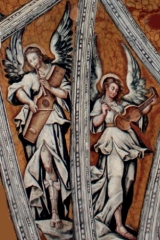 angel playing string drum